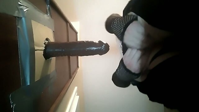 backing up to black dildo