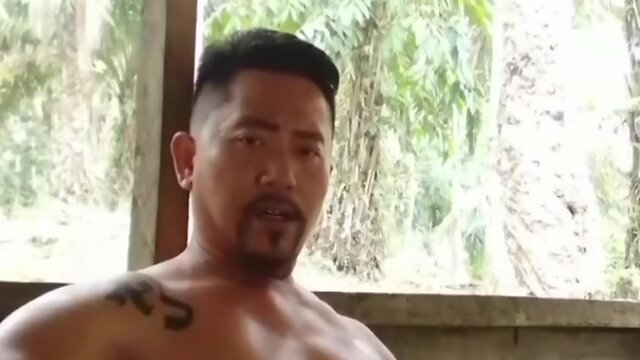 Indonesian muscle daddy gets handjob outdoors from